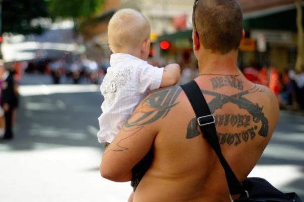 He held the child up so she could see the march. She was too young to understand any of it. That is the point.