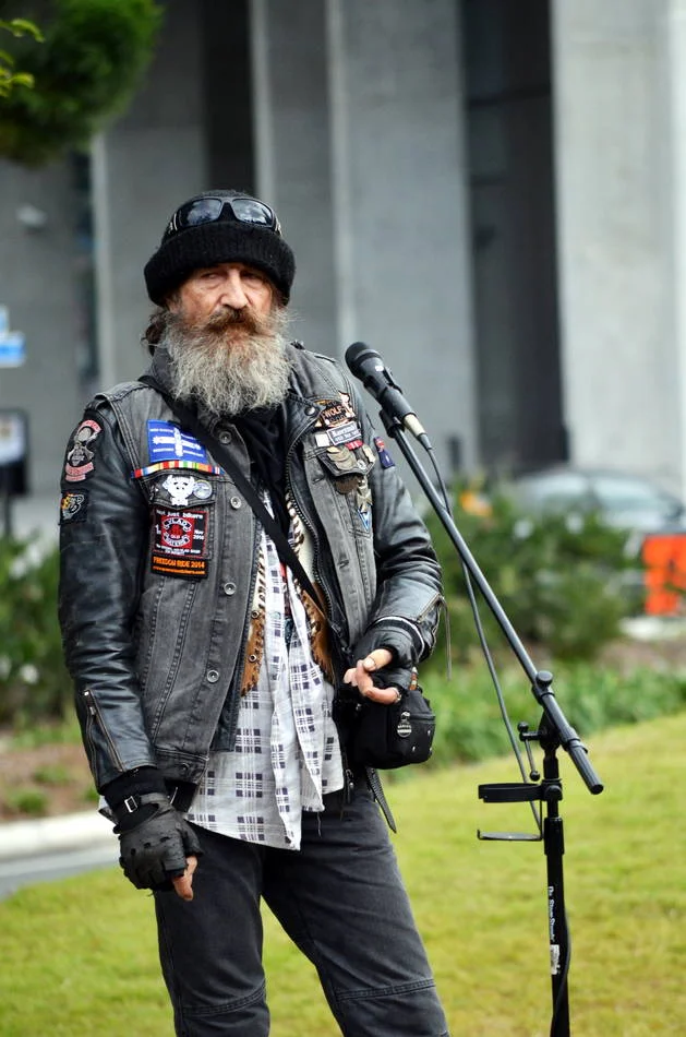 He stood at the microphone with the easy authority of someone who has been speaking up for a long time and expects to keep doing it.