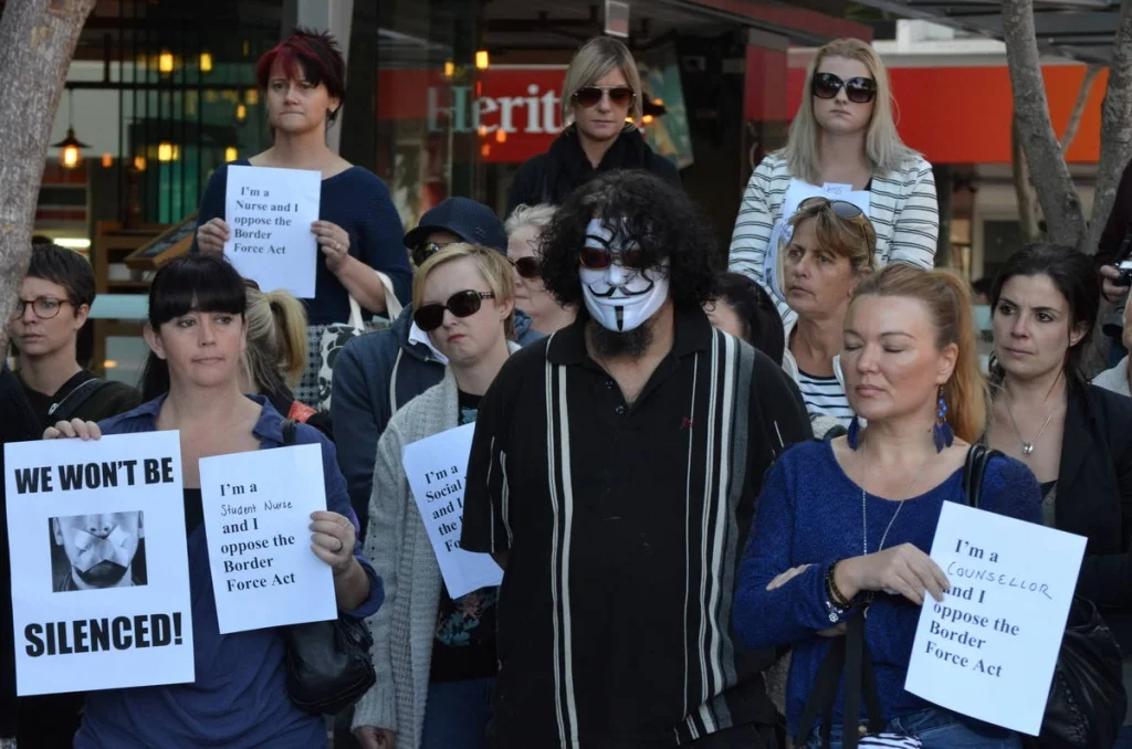 Handwritten 'I'm a [profession] and I oppose the Border Force Act' signs created an accidental collective portrait of the professions that a democracy needs to function.