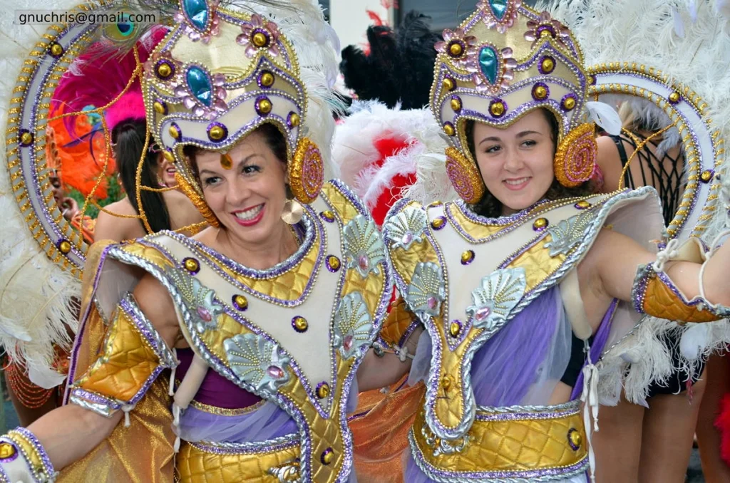 The gold headdresses caught the street lighting and turned every frame into something that looked designed rather than found.