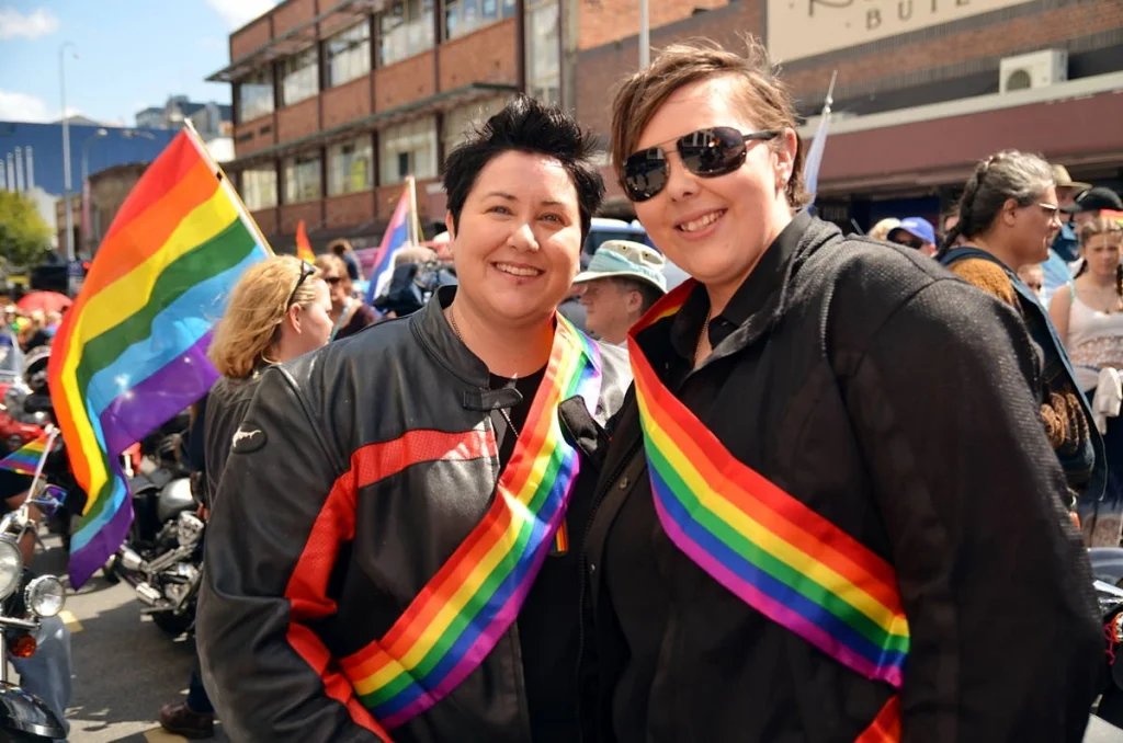 Rainbow sashes, leather jackets, motorcycles. The parade contains multitudes and this image is part of all of them.