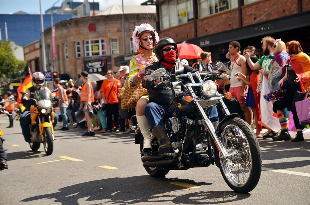 A drag queen riding pillion on a Harley through a Brisbane street. Some photographs justify themselves before you even look through the viewfinder.