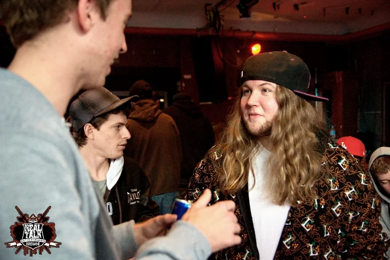The long-haired MC in the patterned jacket was talking to everyone and looking at no one in particular. That kind of dispersed attention is interesting to photograph.