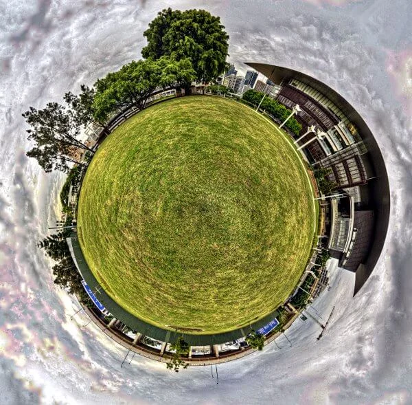 A little planet projection of the precinct — the world curved in on itself, the gallery and the river folded into a sphere.