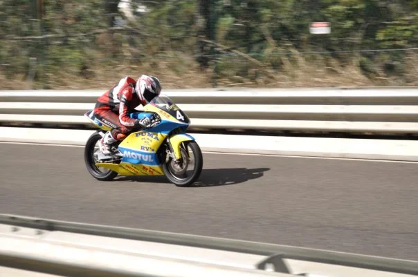 Speed compresses time. A motorcycle at full lean through a corner gives you maybe half a second to find the frame — and no second chance.