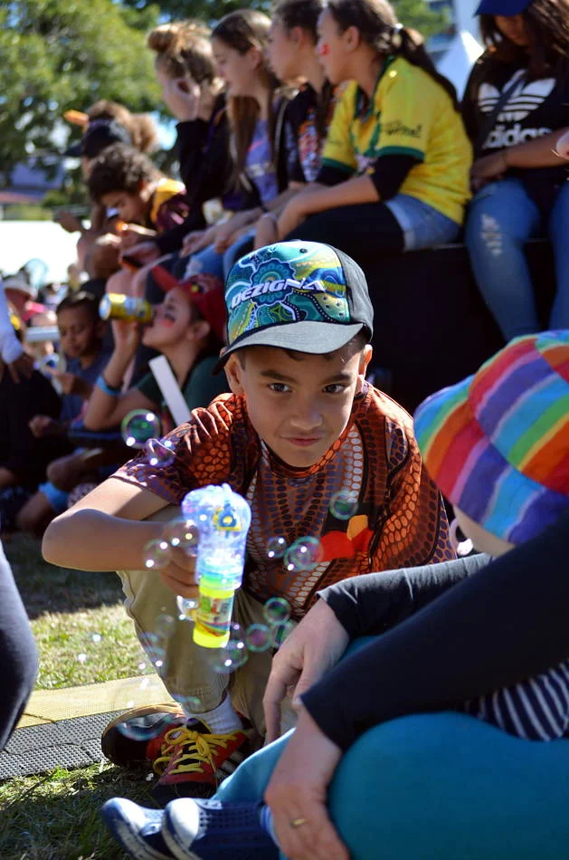 Children at public events are doing their own photography — collecting impressions, chasing what is bright and moving. I try to photograph the way they see.