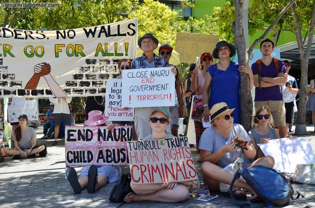 Protest signs are self-portraits. The way a person makes a sign tells you what they believe about language, about image, about whether anyone is listening.
