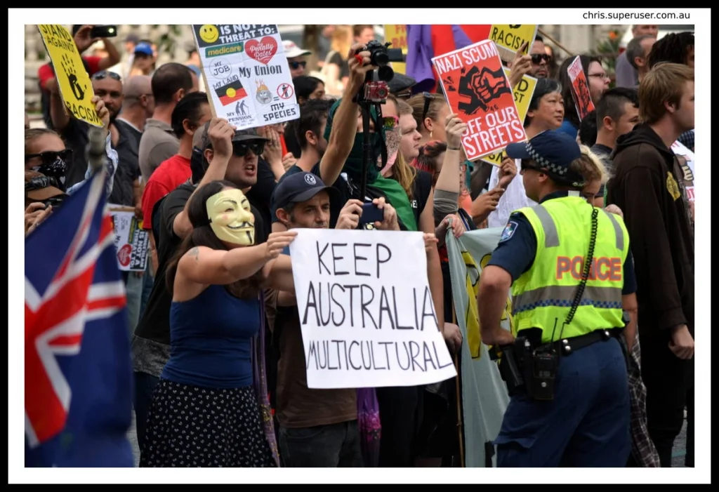 A Guy Fawkes mask and 'Keep Australia Multicultural' at the same event as 'Nazi Scum Off Our Streets' — protest photography requires you to be very clear about what your frame is saying.