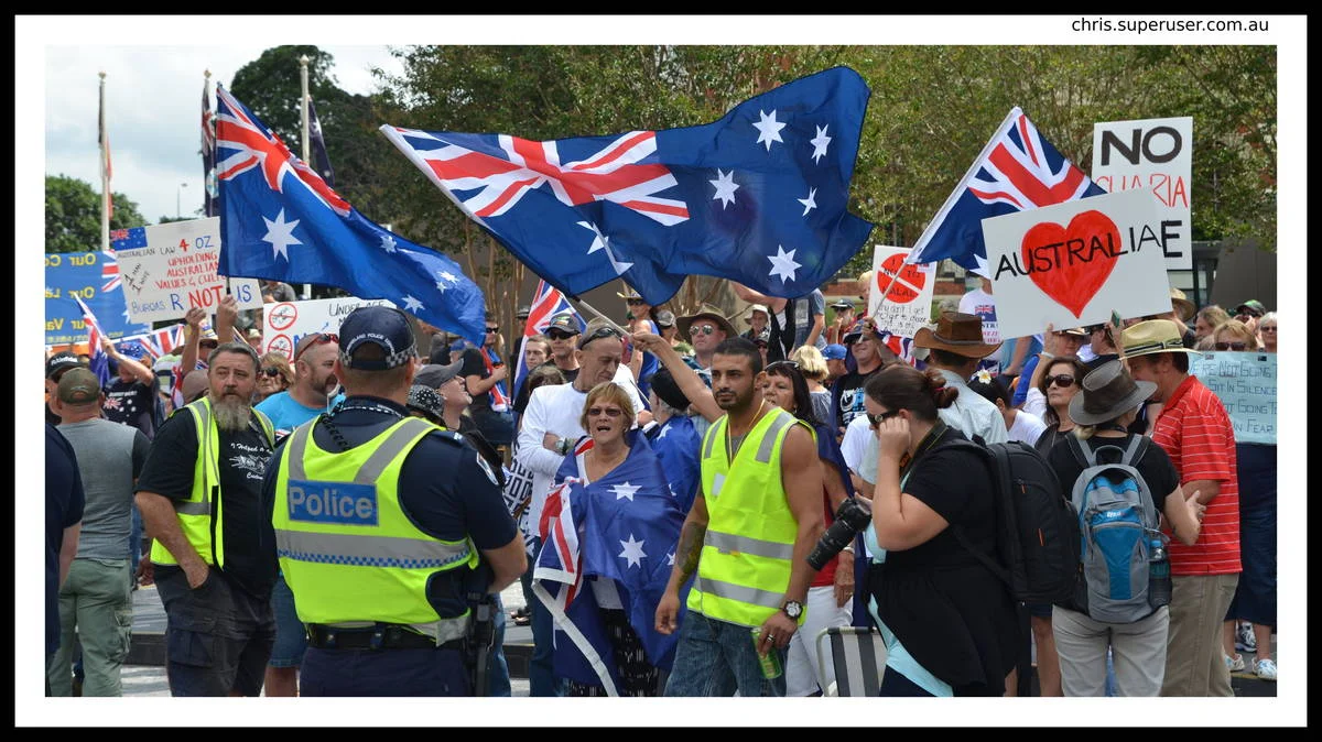 When flags outnumber faces, you are photographing ideology, not people. That is a different kind of portrait and it requires a different kind of attention.